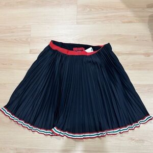 Anthropologie Black Pleated Skirt with Red and Green Trim